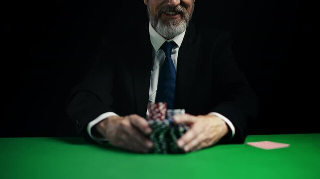 Confident middle-aged man playing poker, raising bet with highest stake
