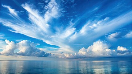 Obraz premium Vast, tranquil ocean reflecting a vibrant sky with dynamic cloud formations, creating a serene atmosphere.