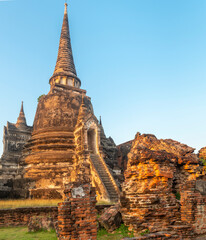 Ayutthaya temple pagoda and section of old wall, at the ancient Royal Palace complex,Thailand.