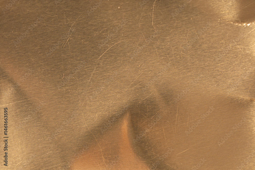 Poster High-resolution image of a scratched gold metal texture. Perfect for backgrounds and design projects.