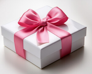 Obraz premium A sophisticated white gift box with a broad, glossy pink ribbon knotted in the ideal bow