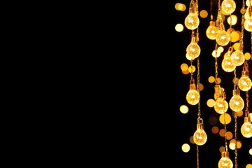 Golden string lights cascade against a black backdrop.  Warm, glowing bulbs hang in clusters, creating a festive, elegant atmosphere.  Bokeh effect adds depth and a sense of celebration