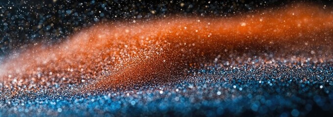 Abstract blend of vibrant orange and blue, glittering particles