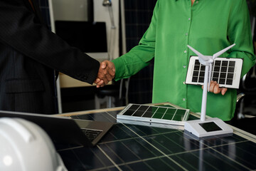 Businessmen shake hands after agreeing to start a new project successfully