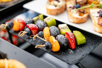 Catering plate. Assortment of snacks on the buffet table 