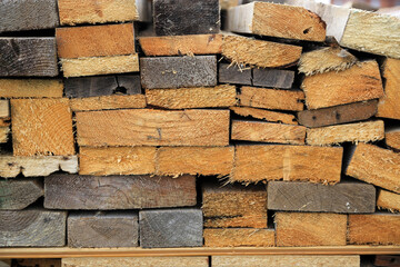 Background of old sawn different shapes and colors boards