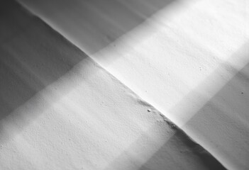 Abstract black and white geometric shapes with contrasting light and shadow effects