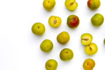 Fresh green plum fruit on white background.