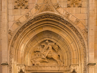 Sculpture of Saint Georges on a horse, slaying a dragon. Detail of Saint Georges church in Lyon,...