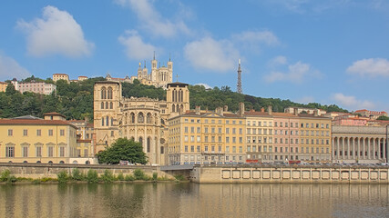 Borders of river Rhone, with Saint-Jean-Baptiste cathedral and of Basilica of Notre-Dame de Fourviere. Lyon, France 