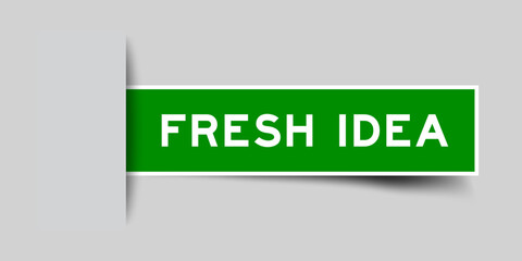 Green color square shape sticker label with word fresh idea inserted in gray background