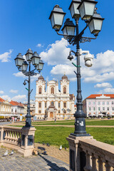 View across Union Square (Piata Unirii) in Timisoara, highlighting ornate historic street lamps and...