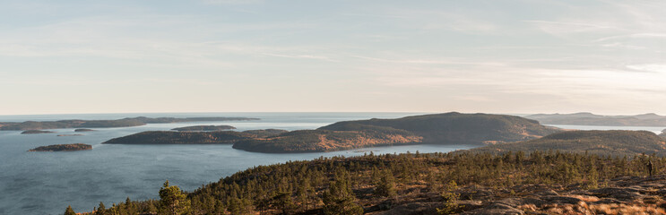 Landscape photo of forests, ocean, mountains and islands in the autmn on the high coast of sweden