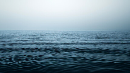 Obraz premium The ocean is calm and peaceful, with no visible waves or ripples