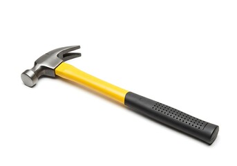 A claw hammer with a yellow and black handle lying diagonally on a plain white surface studio shot