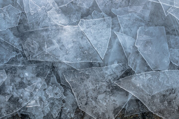 thin cracked ice layers stacking on to of each other 