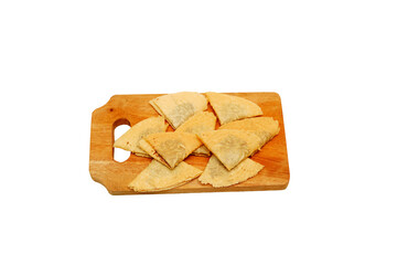 Kue Semprong or Asian egg roll. Indonesian traditional wafer snack made by clasping egg batter using an iron mold. Inside chocolate sauce, served on wooden plate and isolated on white background  