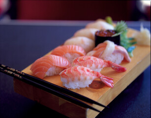 Fresh sushi presented on a wooden board
