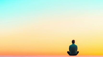 Male silhouette against colorful gradient sky at sunset