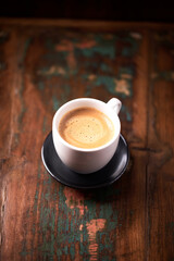 Cup of coffee on wooden background. Soft focus. Copy space	