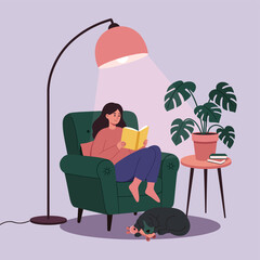 Reading in Comfort: A moment of serene relaxation, where a woman immersed in a book, illuminated by soft light, finds solace in a cozy chair alongside a pet.