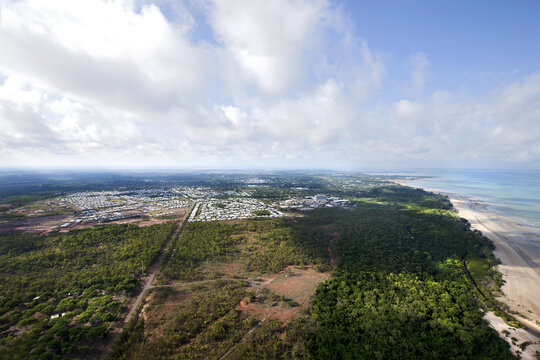 Aerial image of coastline with bushland and housing
