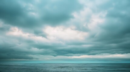 Fototapeta premium Overcast Sky: A sky covered with thick, gray clouds, setting a mood of calm and introspection. 