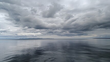 Obraz premium Overcast Sky: A sky covered with thick, gray clouds, setting a mood of calm and introspection. 