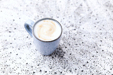 Cappuccino on bright background. Soft focus. Copy space	