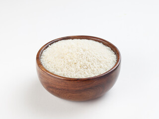 wooden bowl of rice isolated on white table