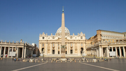 St. Peter's Basilica and the obelisk in the Vatican on a sunny day.