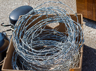 Sharp barb wire in box outside