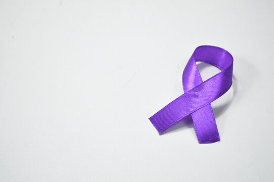 Pancreatic Cancer, world Alzheimer, epilepsy, lupus and domestic violence day Awareness month. Healthcare and World cancer day concept. Purple ribbon for pancreatic cancer and World Lupus Day.