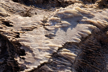 Textured salt formations along the Dead Sea coast in Jordan. Natural crystalline patterns created...