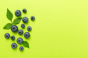 Fresh bright blueberries on color background,top view