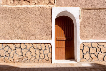 Traditional architecture of Ghardaïa, Algeria – View of the mud houses and minaret of the old town