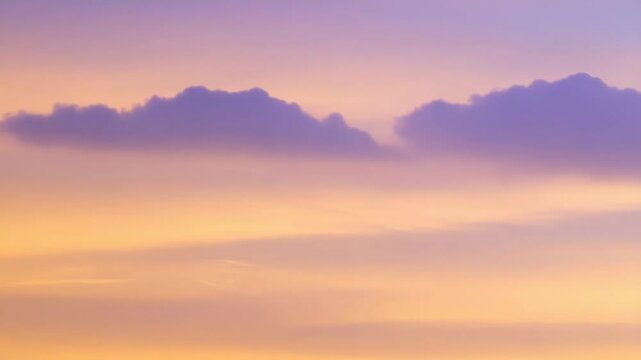 Gentle gradients of peach and violet paint the evening sky, as soft clouds float quietly in distance against an airbrushed heaven.