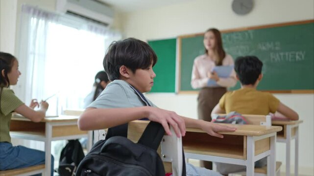 A schoolchild with rucksack to store vital stuff for class