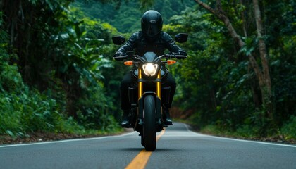 Obraz premium Motorcyclist on a winding road