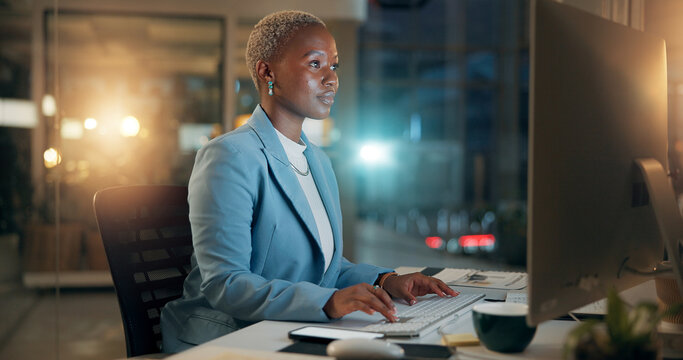 Night, business and black woman typing on computer for email, report or compliance officer on deadline. Keyboard, writing and worker reading for research, regulations or policy development in office