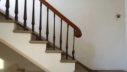 Indoor View of a Wooden and Metal Staircase with White Walls