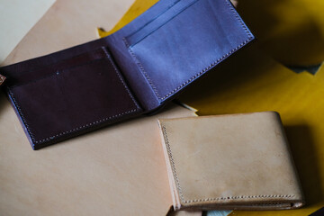 Genuine bifold wallet leather working with tool craftmanship on leather background