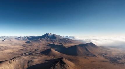 Naklejka premium Vast, arid landscape with towering, snow-capped mountains