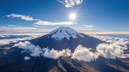 Majestic snow-capped volcano piercing through clouds
