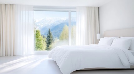 Modern bedroom with mountain views.  Spacious, bright, and minimalist bedroom boasts large windows showcasing a picturesque mountain vista.  White linens and walls create a serene and airy ambiance