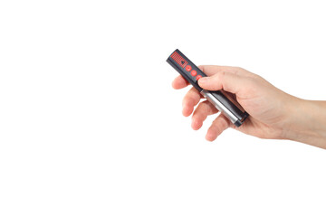 a close-up of a hand holding a universal remote control, designed for operating a garage door or...