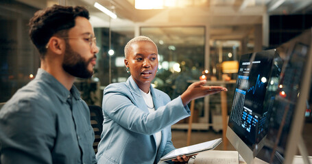 Plakat Computer screen, stock market and tablet with business people in office together for trading at night. Conversation, data or review with employee man and woman at work for portfolio management