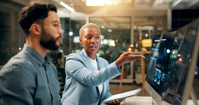 Computer screen, stock market and tablet with business people in office together for trading at night. Conversation, data or review with employee man and woman at work for portfolio management