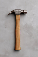 Classic hammer with a wooden handle and metal head, a timeless tool for construction and craftsmanship.