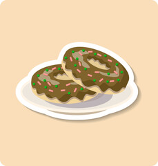 Two chocolate donuts with green and pink sprinkles are lying on a plate